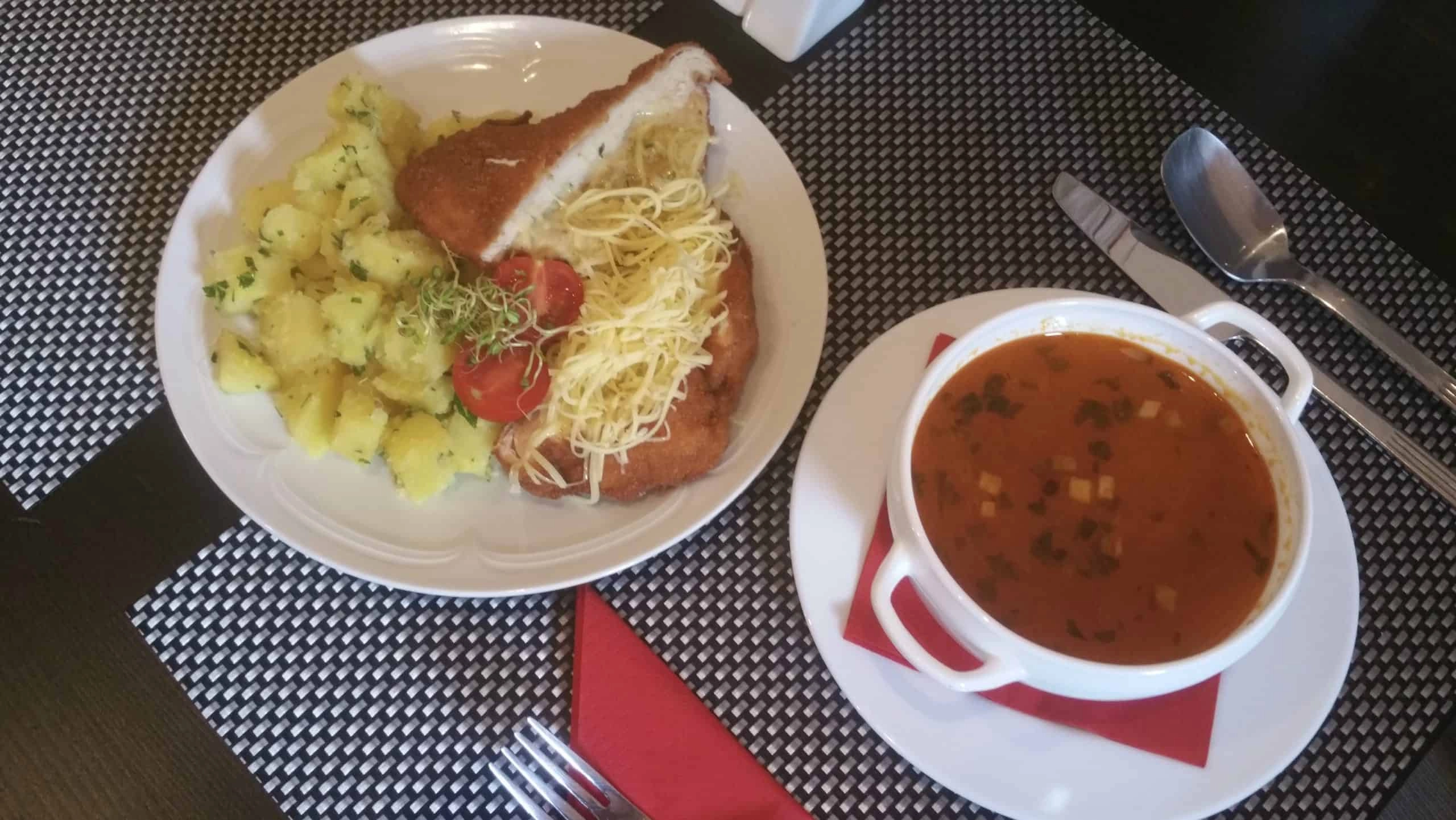 Kohlrabi soup, pork loin baked in cheese crumbs and potatoes with parsley 